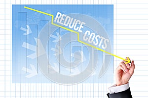 Reduce costs concept with businessman hand draw a graph photo