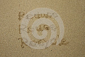 Reduce reuse recycle concept drawn on sand, sustainability