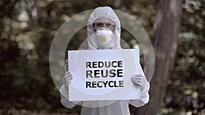 Reduce reuse recycle sign in female chemist hands, toxic planet, no future