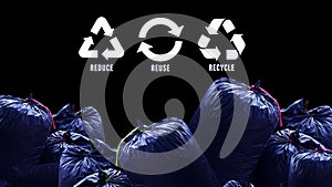 Reduce, reuse, recycle symbol on black garbage bags of rubbish on industry background, ecological metaphor for ecological waste