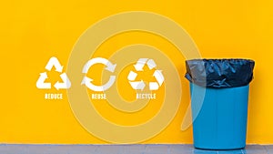 Reduce, reuse, recycle symbol with garbage bin on yellow background, Ecological concept, ecological metaphor for ecological waste