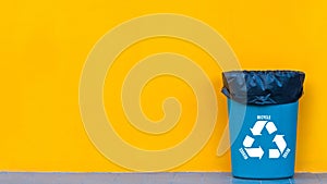 Reduce, reuse, recycle symbol with garbage bin on yellow background, Ecological concept, ecological metaphor for ecological waste