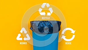 Reduce, reuse, recycle symbol with garbage bin on yellow background, Ecological concept, ecological metaphor for ecological waste