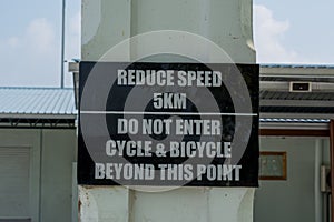 Reduce speed 5km do not enter cycle & bicycle beyond this point sign