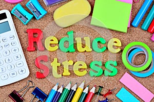 Reduce stress words on cork background