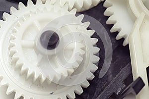 Reducer gears of white plastic closeup