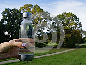 Reducing plastic waste series; Avoid buying bottled water, use tap water in a recyclable plastic bottle on a picnic.
