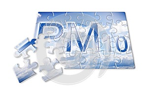 Reduction of particulate matter PM10 in the air - concept image in puzzle shape photo