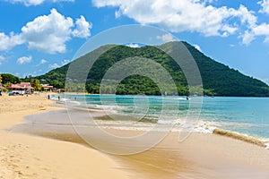 Reduit Beach - Tropical coast on the Caribbean island of St. Lucia. It is a paradise destination with a white sand beach and