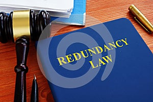 Redundancy law book with gavel