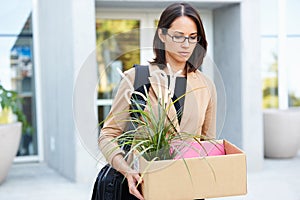 Redundant Businesswoman Leaving Office