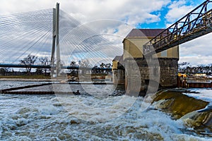 Redzinski weir over Odra river in front of Redzinski highway bridge at sunny cloudy day