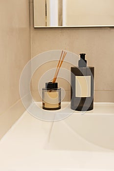 Reed diffuser and hand soap product display bathroom background