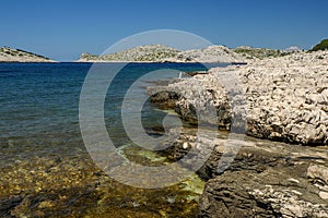 Reef rocks beach shoreline Archipelago - Islands of the Kornati archipelago panorama landscape of national park in Croatia view