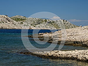 Reef rocks beach shoreline Archipelago - Islands of the Kornati archipelago panorama landscape of national park in Croatia view