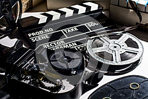 Reel with film and cinema clap