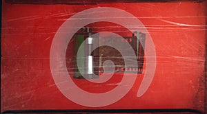 Reel of old photographic film on a red background. Web banner.