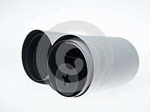 A reel of photographic film on a white background