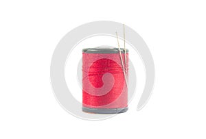 Reel or spool of red sewing thread isolated on white. background