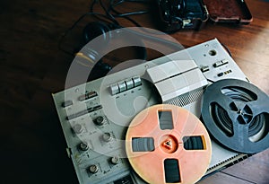 Reel tape recorder for wiretapping. Field telephone set USSR is lying nearby.  KGB spying conversations