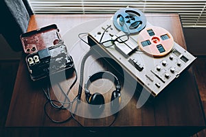 Reel tape recorder for wiretapping . Field telephone set USSR is lying nearby.  KGB spying conversations