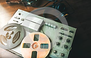 Reel tape recorder for wiretapping. Field telephone set USSR is lying nearby.  KGB spying conversations