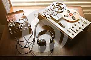 Reel tape recorder for wiretapping . Field telephone set USSR is lying nearby.  KGB spying conversations photo