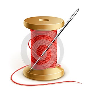 Reel with thread and needle photo