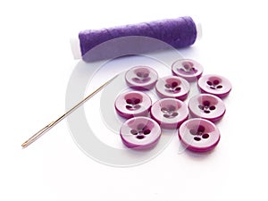 Reel of thread, needle and buttons