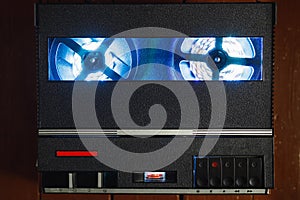 Reel to reel audio tape recorder with blue led light strip. VU meter with
