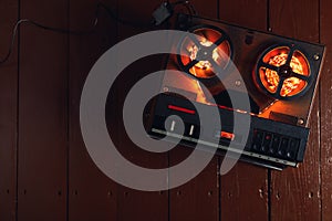 Reel to reel audio tape recorder with orange led light strip