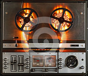 Reel to reel audio tape recorder with orange led light strip