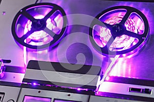 Reel to reel audio tape recorder with purple led light strip