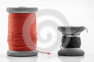 Reels or spools of multicolored sewing threads. Threads of all c