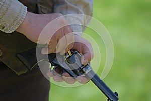 Reenactor loads replica gun