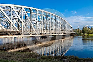 Refection of bridge upon the river in Finland