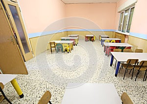 Refectory of a school for children with small chairs and tables photo