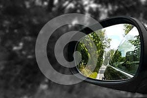 Refelection of convertible in the back of a car wingmirror car motorsport with black and white greyscale contrast