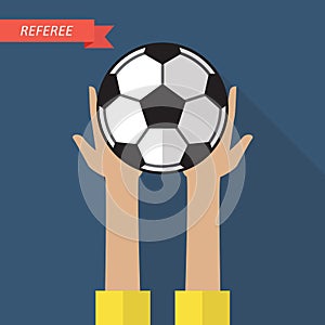 Referee hand holding a soccer ball
