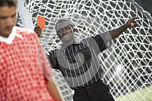 Referee holding out red card