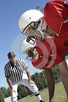 Referee Watching Football Players