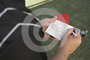 Referee Writing In img