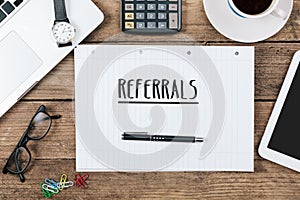 Referrals on notebook on Office desk with computer technology, h