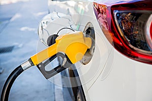 Refill and filling Oil Gas Fuel at station.Gas station - refueling.To fill the machine with fuel