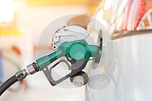 Refill and filling Oil Gas Fuel at station.Gas station - refueling.To fill the machine with fuel. Car fill with gasoline at a gas