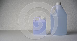 refill gallon and bottle of hand gel or hand sanitizer alcohol gel on white foam background