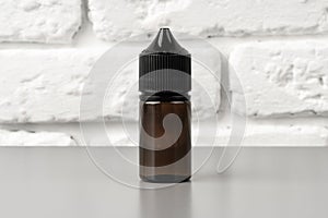 Refill liquid for electronic cigarettes on gray background