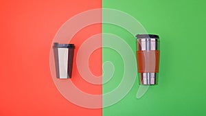 Refillable and disposable coffee cups on half red and green background. Plastic-free and zero waste living concept.