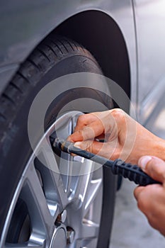 Refilling air into car tire