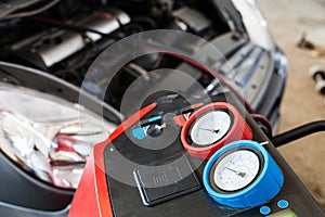 Refilling of car conditioner in auto repair shop